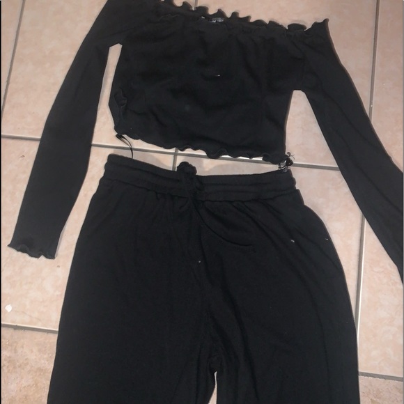 a set of off shoulder crop top and sweats